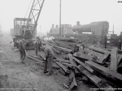 Sunday 4th March . Just before another tea break we had the services of the mobile green house (crane!) to help sort out the pile of sleepers that arrived the previous day. With Pat Good fellow, Steve marks and Dean Knights?